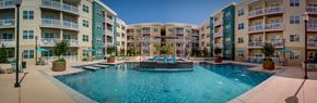 Jackson apartment for rent - an apartment building with a large pool in front of it