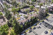 Lake Balboa apartment for rent - A street view of a residential area with houses and parked cars.