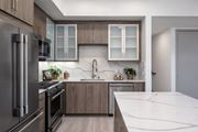 Canoga Park apartment for rent - a kitchen with stainless steel appliances and marble counter tops