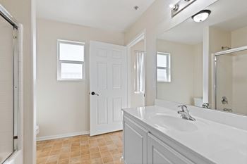 Spacious bathtub with enclosed shower doors