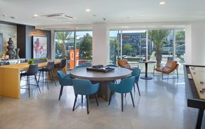 Woodland Hills apartment for rent - a dining room with a table and chairs in a room with large windows