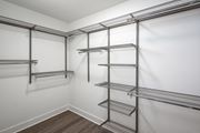 Canoga Park apartment for rent - a spacious walk in closet with empty shelves and white walls