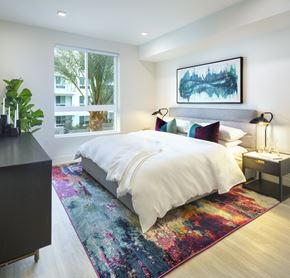Woodland Hills apartment for rent - a bedroom with a bed and a rug in front of a window