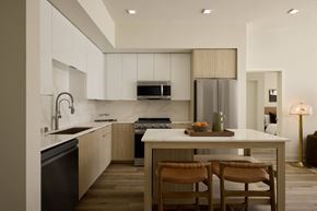 Woodland Hills apartment for rent - A modern kitchen with a dining table and chairs.