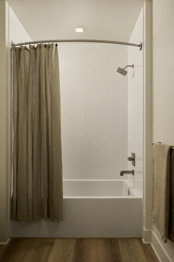 Oversized soaking bathtubs with hand-set tile