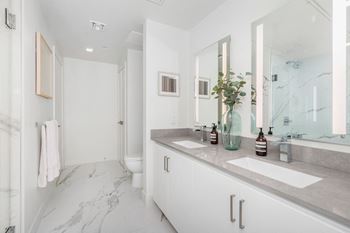 Custom light framed mirrors in bathrooms