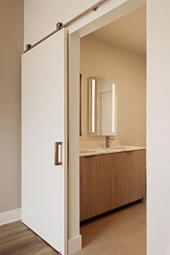 Custom light framed mirrors in bathrooms