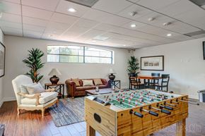 Canoga Park apartment for rent - a game room with a foosball table and chairs at Le Blanc Apartment Homes, Canoga Park