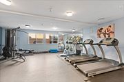 Sylmar apartment for rent - two treadmills and other exercise equipment in a gym with blue walls at Dronfield Astoria Sylmar, 91342