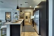 Glendale apartment for rent - kitchen with an island and a refrigerator at Cuvee, Glendale, AZ 85305
