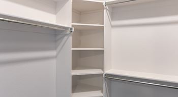 Walk in closet with shelves at elevation san tan