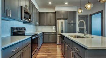 Gourmet kitchen with island and stainless steel appliances