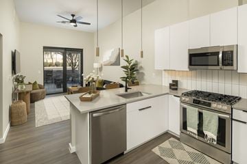 Scottsdale apartment for rent - A modern kitchen with a stainless steel dishwasher and oven.