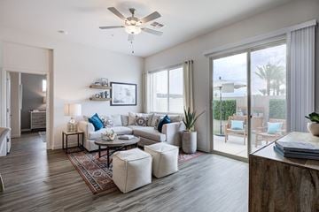 Peoria apartment for rent - a living room with a couch and a ceiling fan