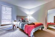 Seattle apartment for rent - A bedroom with a bed, nightstand, and window