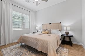Chandler apartment for rent - a bedroom with a large bed and a window at Village of Chandler Apartments, Arizona
