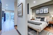 Seattle apartment for rent - A bedroom with a large bed and a balcony.
