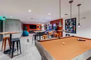 Seattle apartment for rent - A room with a pool table and a bar area.