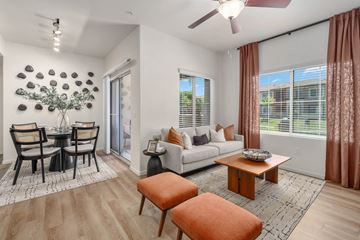 Peoria apartment for rent - A living room with a dining table and chairs.