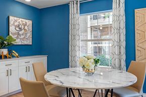 Houston apartment for rent - a dining room with a table and chairs and a window
