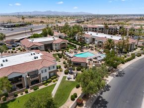 Sun City apartment for rent - A large apartment complex with a swimming pool in the middle.