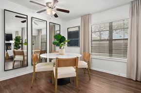 Tucson apartment for rent - A dining room with a round table and chairs.