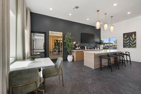 Tucson apartment for rent - A modern kitchen with a dining table and chairs.