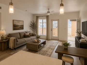 Tucson apartment for rent - A living room with a grey couch, a wooden coffee table, and a painting on the wall.