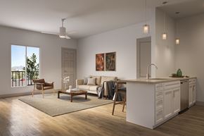 Tucson apartment for rent - A modern living room with a kitchen area in the background.