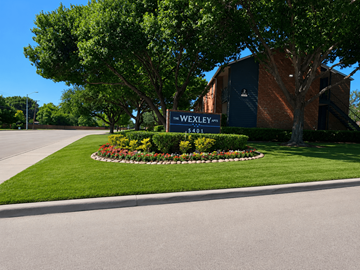 Plano apartment for rent - A sign for Wexley stands in front of a building.