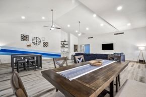 Sierra Vista apartment for rent - A modern dining room with a wooden table and chairs.