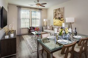 Scottsdale apartment for rent - A modern dining room with a glass table and chairs.