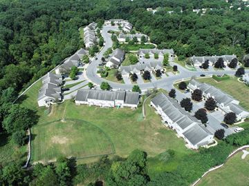 Harrisburg apartment for rent - an aerial view of a community of buildings and trees