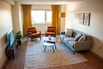 Salem apartment for rent - a living room with a couch and chairs and a tv