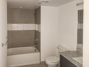 Miami apartment for rent - a bathroom with a toilet and a tub and a sink at Meridian Point at Goulds Station in Miami, FL, 33170