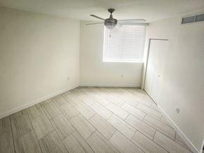 Miami apartment for rent - an empty room with a ceiling fan and a window at Meridian Point at Goulds Station in Miami, FL, 33170