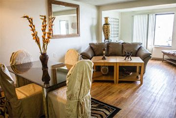 Detroit apartment for rent - a living room with a couch and a table