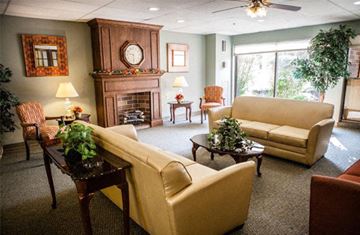 Troy apartment for rent - a living room with couches and chairs and a fireplace