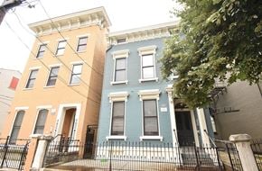 Cincinnati apartment for rent - a blue house and a yellow house are next to each other