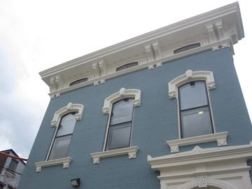 Cincinnati apartment for rent - the side of a blue building with three windows