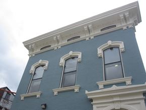 Cincinnati apartment for rent - the side of a blue building with three windows