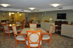 Boston apartment for rent - a dining room with tables and chairs and a tv