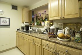 Boston apartment for rent - a kitchen with wooden cabinets and a granite counter top