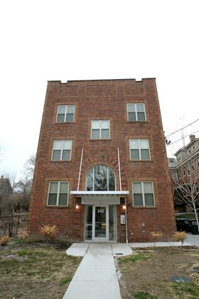 Cincinnati apartment for rent - the front of a brick building with a sidewalk in front