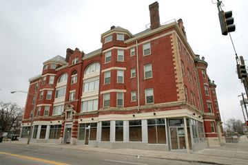 Cincinnati apartment for rent - a red brick building on the corner of a street