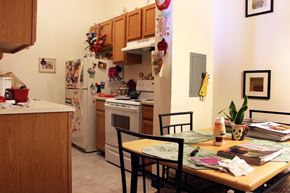Pittsfield apartment for rent - the kitchen and dining area of a small apartment with a table and chairs