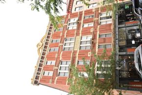 Cincinnati apartment for rent - a tall building with a ladder on the side of it