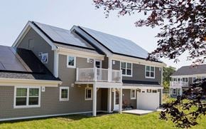South Dennis apartment for rent - a gray house with solar panels on the roof