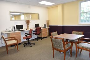 Salem apartment for rent - a conference room with desks and chairs and a table