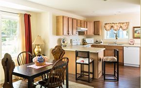 South Dennis apartment for rent - a kitchen and dining area with a table and chairs